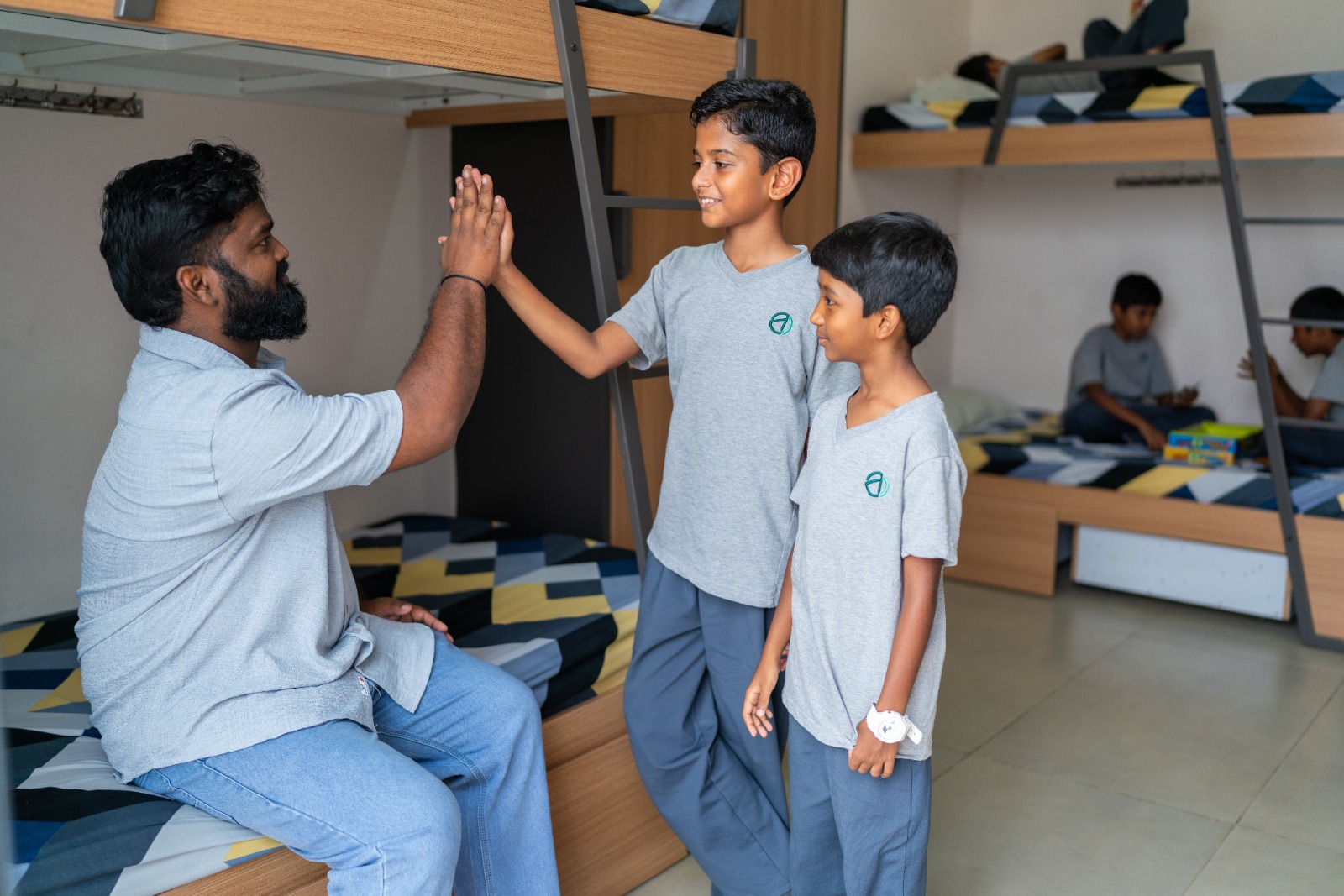 Students and dorm parent in the TACS boarding hostel